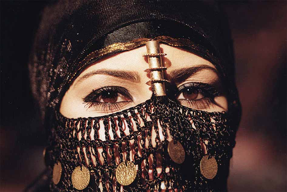 Photograph of a woman's face under a Bedouin headress