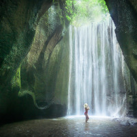 Tukad Cepung Waterfall is hidden in a narrow canyon